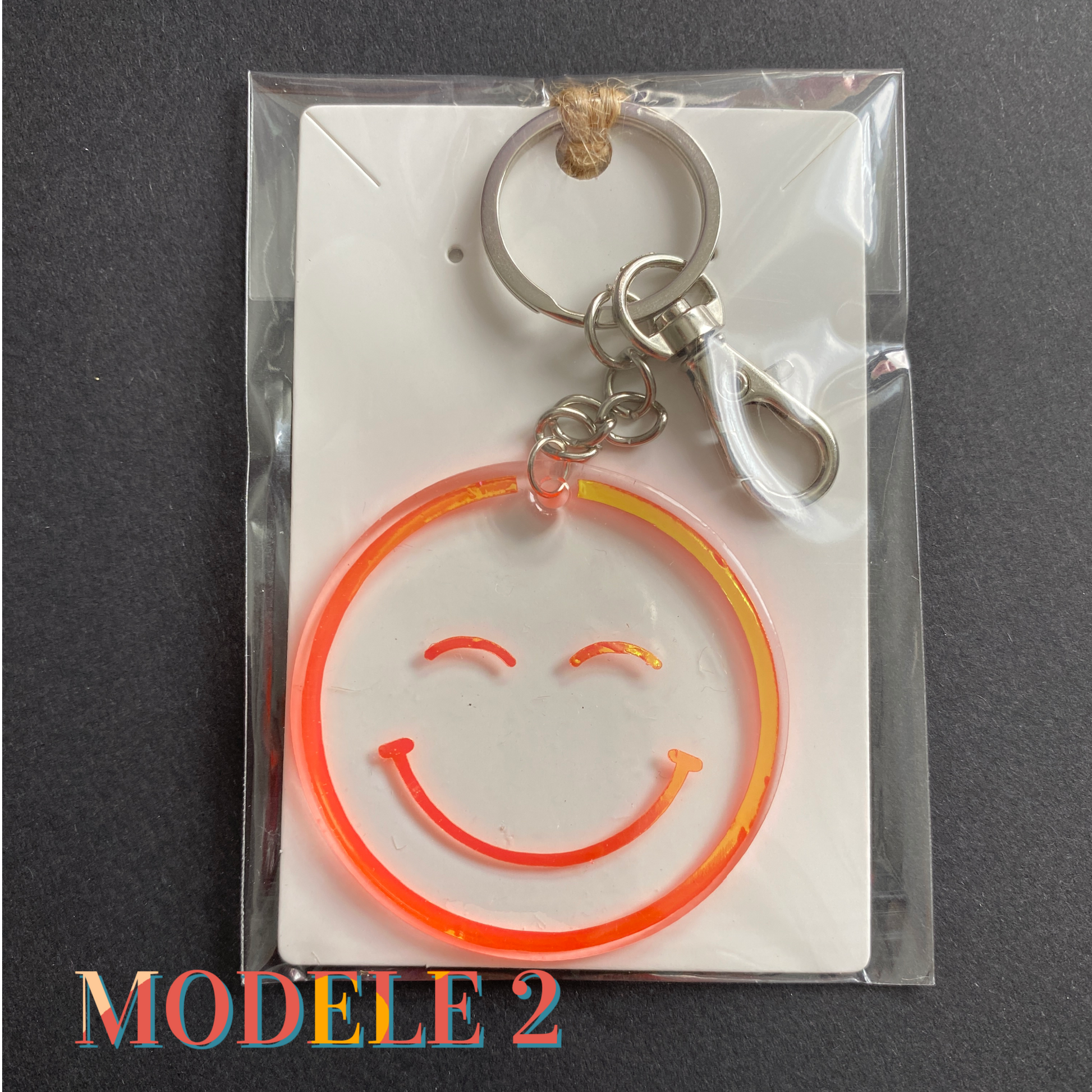 porte-clés happy face smiley holographiques orange